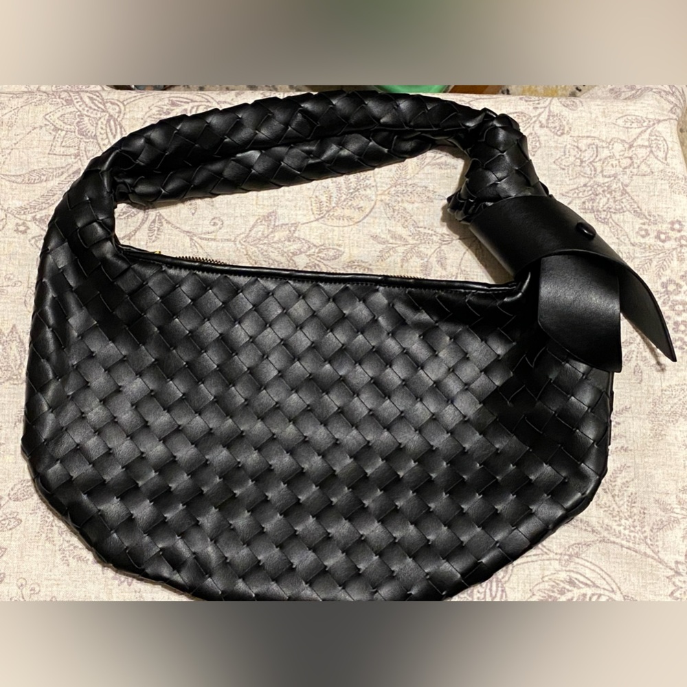 Braided vegan leather black shoulder bag.